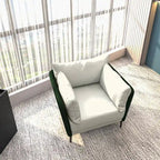 Fauteuil moderne monoplace en similicuir rembourré avec pieds en métal pour salon